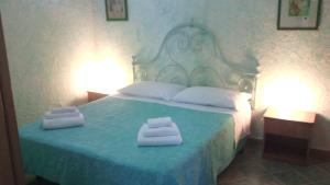 Ένα ή περισσότερα κρεβάτια σε δωμάτιο στο La Casa Dei Delfini