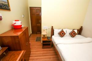 Postel nebo postele na pokoji v ubytování Hotel Cecil