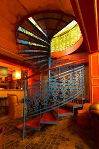 a room with a staircase in a room with a window at Rynek 16 in Sandomierz