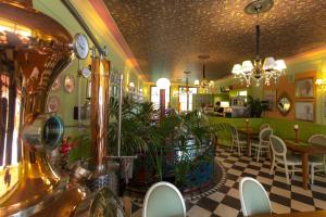 a restaurant with a table and chairs in a room at Rynek 16 in Sandomierz