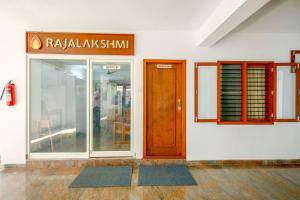 a building with a door and a sign on it at Manasarovar Homes - Rajalakshmi Serviced Apartments in Tiruvannāmalai