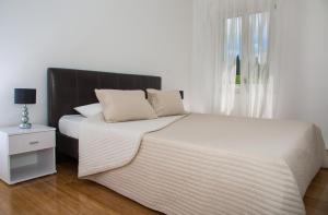 Ένα ή περισσότερα κρεβάτια σε δωμάτιο στο Apartments Victoria