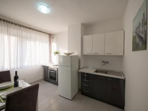 Kuchyň nebo kuchyňský kout v ubytování GIN apartman