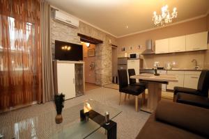 a living room with a kitchen and a dining room at Apartment Anitea in Pula