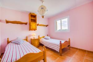 Ένα ή περισσότερα κρεβάτια σε δωμάτιο στο Villa Marcos Lago Esperanza
