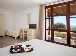 Letto o letti in una camera di Agriturismo Nuraghe Tuttusoni