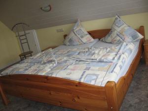Кровать или кровати в номере Tor zum Darss