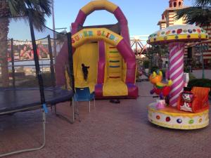 a playground at a amusement park with a roller coaster at Porto Ain Sokhna chalet with sea and pool view in Ain Sokhna