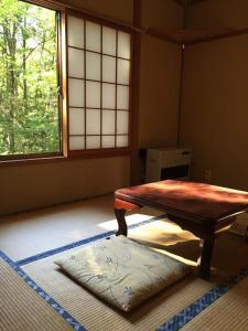 Cama ou camas em um quarto em Maison de Sasagawa