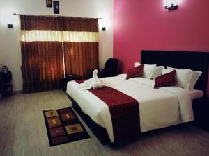 Tempat tidur dalam kamar di Hotel Lemon Stay