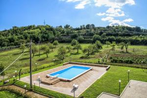 an overhead view of a swimming pool in a field at Tenuta Cerreto in Calvi Vecchia