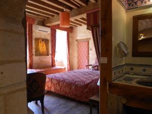 Postel nebo postele na pokoji v ubytování Auberge de l'Abbatiale