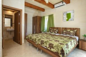 a bedroom with a large bed in a room at Carini Farmhouses in Għarb +101 photos