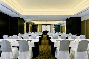 a room filled with tables and chairs filled with tables at Ascott Sathorn Bangkok - SHA Plus Certified in Bangkok