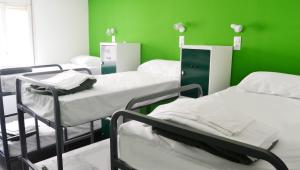 Motion Chueca Hostel客房内的一张或多张床位