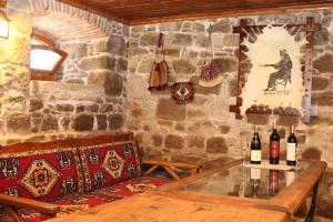 a room with a table and some bottles of wine at Hera Hotel in Bergama