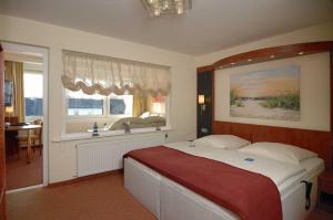 Postel nebo postele na pokoji v ubytování Hotel Hansa
