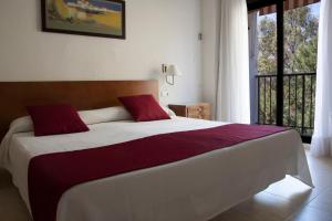 Postel nebo postele na pokoji v ubytování Hotel Sicania
