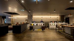 a lobby of a store with people standing in the background at Hotel Resol Nagoya in Nagoya