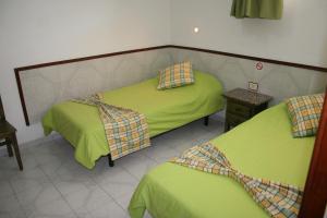 A bed or beds in a room at Apartamentos Maba Playa