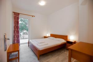 Кровать или кровати в номере Porto Assini