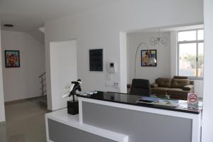 a living room with a table and a couch at Vista Mar in Tarrafal