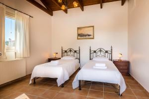 Кровать или кровати в номере Villa Thalea