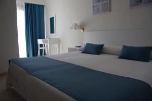 Postel nebo postele na pokoji v ubytování Hotel Sicania