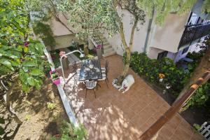 an overhead view of a patio with a table and chairs at Villa Milton Hvar in Hvar