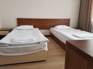 Кровать или кровати в номере Azure Sport Resort