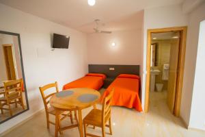 TV a/nebo společenská místnost v ubytování Apartamentos Zodiac