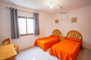 Postel nebo postele na pokoji v ubytování Apartamentos Zodiac + 27 fotografií