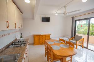 Kuchyň nebo kuchyňský kout v ubytování Apartamentos Zodiac