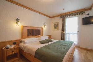 Postel nebo postele na pokoji v ubytování Hotel Centrale