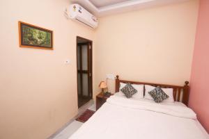 Postel nebo postele na pokoji v ubytování Hotel Cecil
