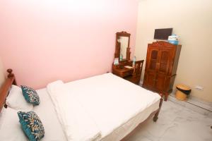 Postel nebo postele na pokoji v ubytování Hotel Cecil