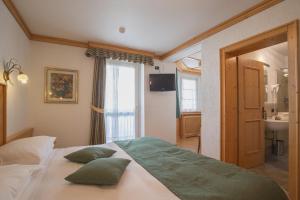 Postel nebo postele na pokoji v ubytování Hotel Centrale