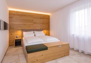 Voodi või voodid majutusasutuse 24/7 Zimmer Asten toas