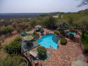 an aerial view of a swimming pool at a resort at Kirawira Serena Camp in Handajega