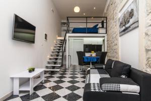 TV a/nebo společenská místnost v ubytování Studio Apartman REA