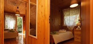 Postel nebo postele na pokoji v ubytování Poilsio baze