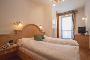 Postel nebo postele na pokoji v ubytování Hotel Centrale