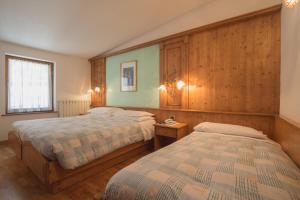 Postel nebo postele na pokoji v ubytování Hotel Centrale