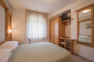Postel nebo postele na pokoji v ubytování Hotel Centrale