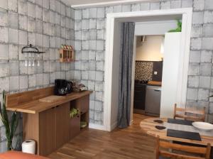 a kitchen with a counter and a dining room at Number 7 Gouarec in Gouarec
