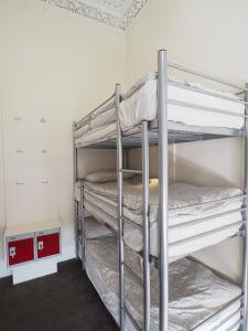 a bedroom with two bunk beds in a room at The Hostel in Edinburgh