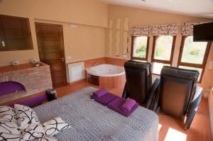 a living room with a table and a fireplace at Casa Rural Caseta de l' Hort in Villafranca del Cid