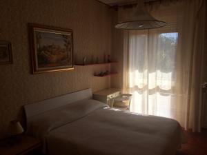 Postel nebo postele na pokoji v ubytování B&B Dai Nonni