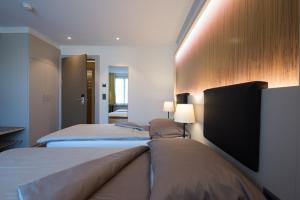 Postel nebo postele na pokoji v ubytování Hotel Jardin Bern