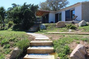 a house with stairs leading to a yard at Villa Giulia in Porto-Vecchio